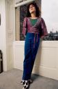 <p>Glam rock star Marc Bolan, frontman for the act T. Rex, at home in velvet trousers and checkered shoes in 1975.</p>