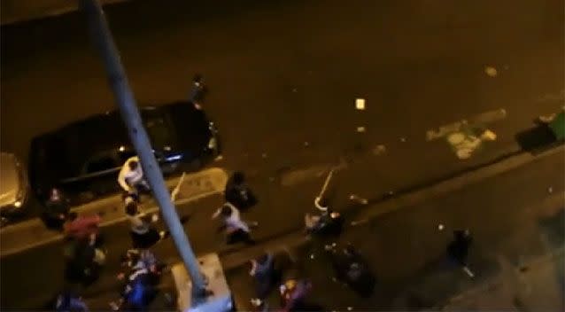 Police dispersed the violence by throwing tear gas at the melee.  Source: Youtube/ Arnault CHENE