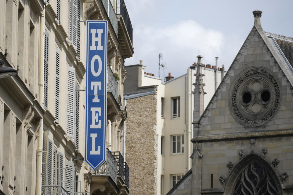 A sign advertising an hotel is pictured in Paris Thursday, July 20, 2023. Paris touted its large and diverse accommodation options – everything from campsites along the River Seine to some of the world's most famous luxury hotels – when it was bidding for the Games, boasting that it has "more than sufficient accommodation" to host France's first Summer Games in a century and millions of Olympic visitors. (AP Photo/Christophe Ena)