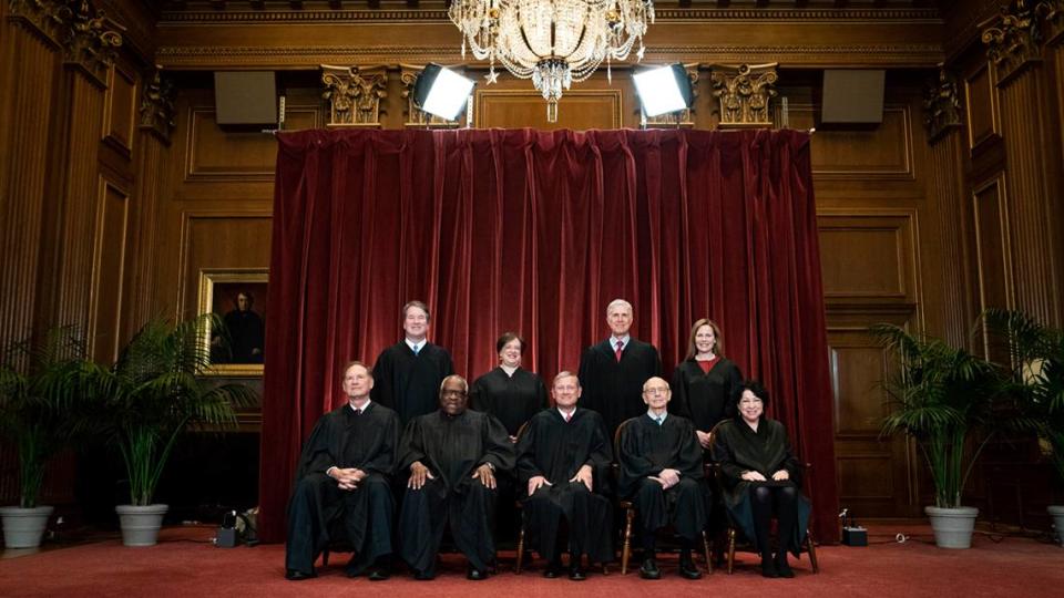 Members of the Supreme Court on April 23, 2021. Seated from left are Associate Justice Samuel Alito, Associate Justice Clarence Thomas, Chief Justice John Roberts, Associate Justice Stephen Breyer and Associate Justice Sonia Sotomayor, Standing from left are Associate Justice Brett Kavanaugh, Associate Justice Elena Kagan, Associate Justice Neil Gorsuch and Associate Justice Amy Coney Barrett. 