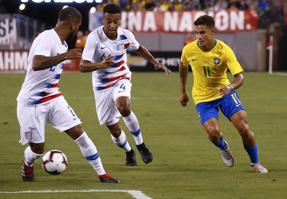 EAST RUTHERFORD, NJ - SEPTEMBER 07: DeAndre Yedlin #2 of USA and Tyler Adams #4 of USA defend Philippe Coutinho #11 of Brazil during their friendly match at MetLife Stadium on September 7, 2018 in East Rutherford, New Jersey. (Photo by Jeff Zelevansky/Getty Images)