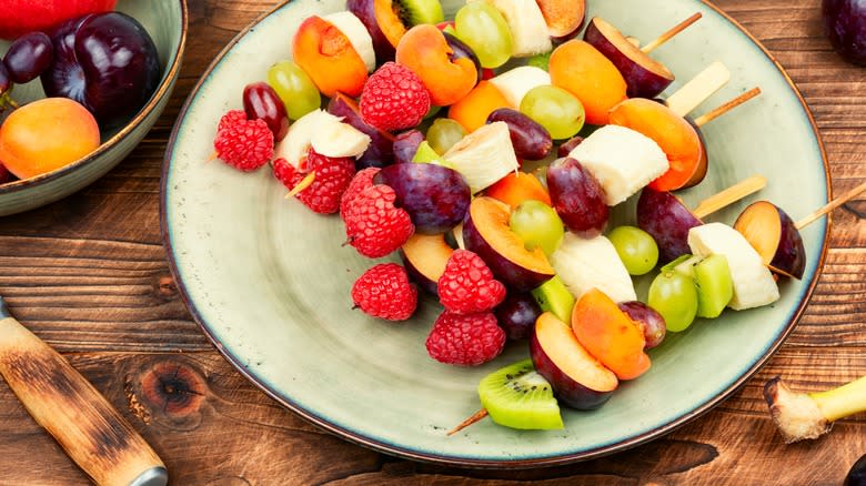 fruit skewers on plate