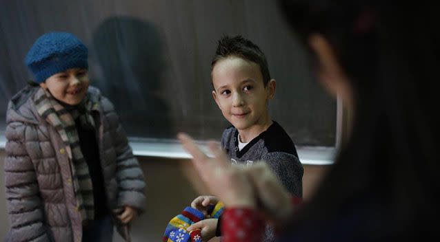 Zejd Coralic learns sign language from teacher in Bosnia. Source: AP/ Amel Emric