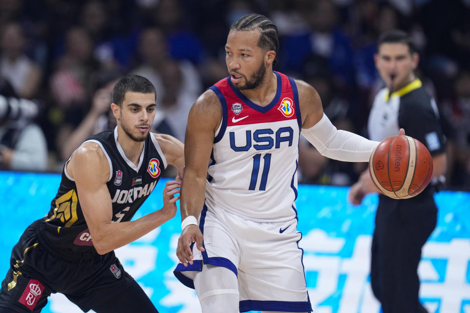 Jordan guard Freddy Ibrahim (5) defends U.S. guard Jalen Brunson (11) during the first half of a Basketball World Cup group C match in Manila, Philippines Wednesday, Aug. 30, 2023. (AP Photo/Michael Conroy)