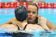 (L-R) Missy Franklin of the United States and Federica Pellegrini of Italy react after they competed in the second semifinal heat of Women's 200m Freestyle on Day 3 of the London 2012 Olympic Games at the Aquatics Centre on July 30, 2012 in London, England. (Photo by Al Bello/Getty Images)