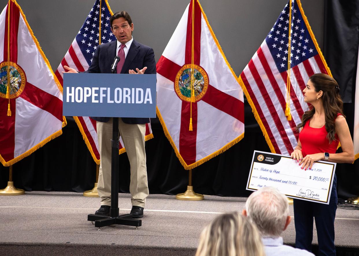 Gov. Ron DeSantis holds a press conference about the "Hope Florida Fund" on May 9 at Beachside Fellowship Miracle Center in Panama City Beach. He was accompanied by his wife, Casey, and their children.