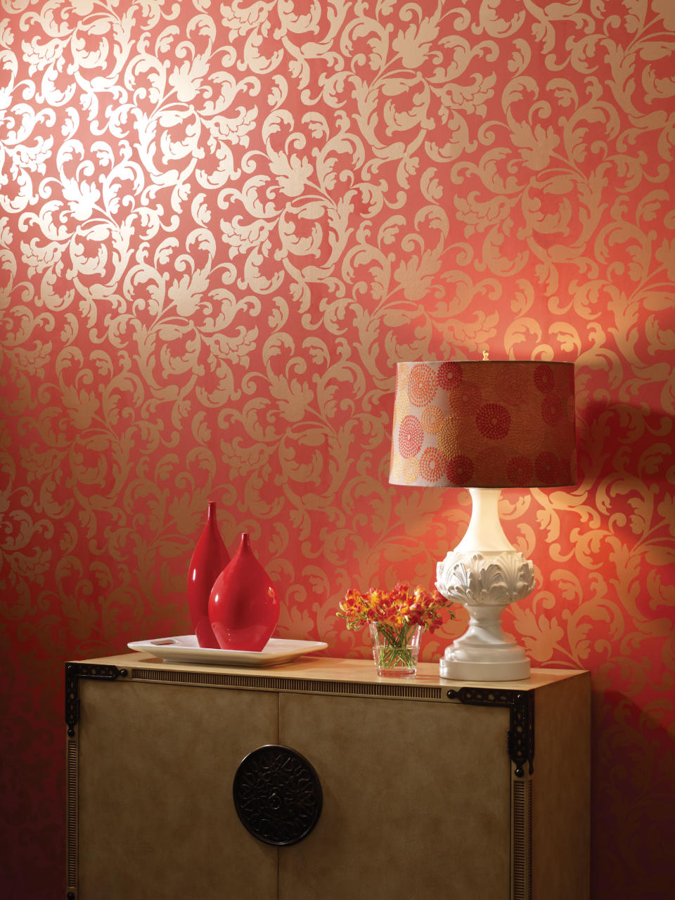 In this image released by York Wallcoverings, an Arabella in Metallic Gold on Orange Spice wall pattern is shown. Bold, dramatic and invigorating, Tangerine Tango is dancing its way into home decor trends in 2012 with a punch of reddish-orange panache. The hue is a vivacious alternative to last year’s cheery honeysuckle, and design experts say it’s easy to incorporate into any home. (AP Photo/York Wallcoverings)
