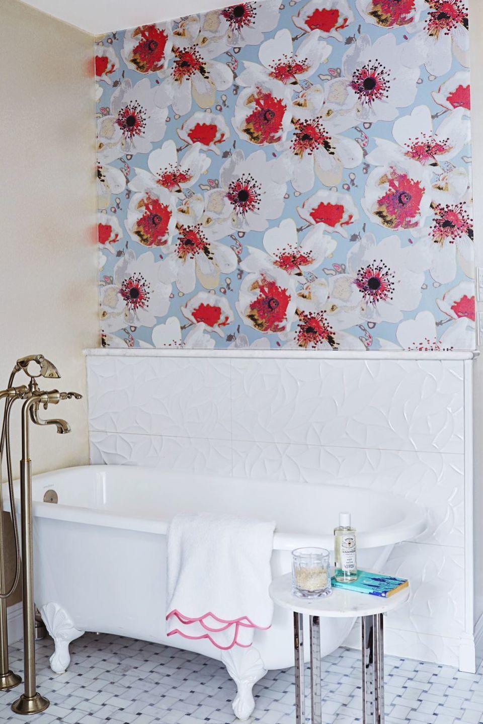 <p>Tile often finds a home near bathtubs and showers, but this gorgeous design will inspire something more eye-catching. Opt for vinyl wallpaper since it's washable and able to withstand moisture and heat.</p>