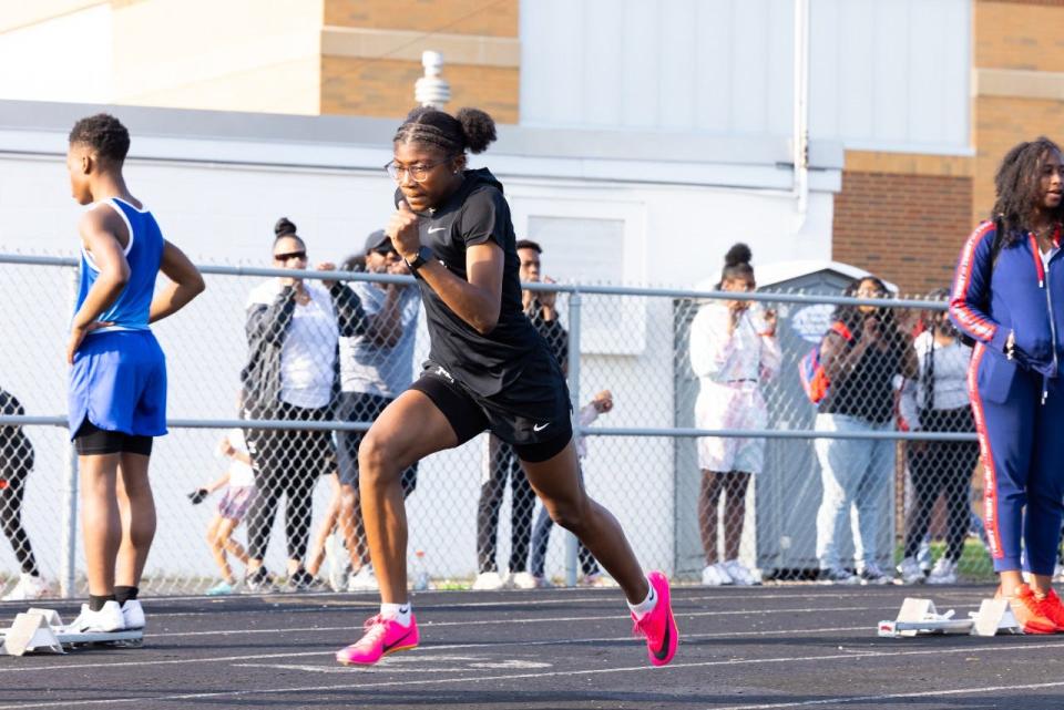 Miniya Mitchell runs for the I Promise School's girls track and field team last season.