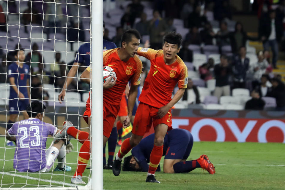 China's forward Xiao Zhi celebrates after scoring his side's opening goal during the AFC Asian Cup round of 16 soccer match between Thailand and China at the Hazza Bin Zayed stadium in Al Ain, United Arab Emirates, Sunday, Jan. 20, 2019. (AP Photo/Hassan Ammar)