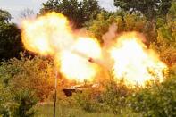 A howitzer of pro-Russian troops fires in the Luhansk region
