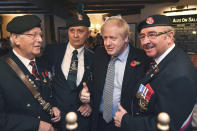 Britain' Prime Minister Boris Johnson meets with military veterans at the Lych Gate Tavern in Wolverhampton, England, Monday, Nov. 11, 2019 as part of the General Election campaign trail. Britain goes to the polls on Dec. 12. (Ben Stansall/Pool Photo via AP)