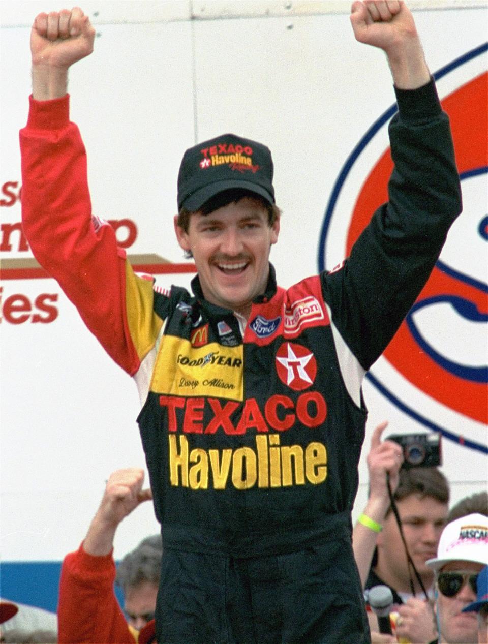 FILE - In this Feb. 16, 1992, file photo, Davey Allison celebrates after winning the Daytona 500.