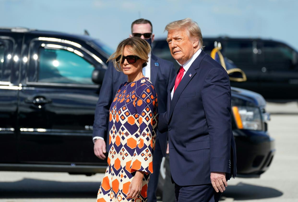 Former President Donald Trump and First Lady Melania arrive at Palm Beach International Airport in West Palm Beach, Fla. on Jan. 20. 