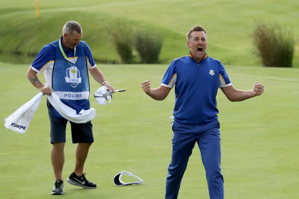 PARIS, FRANCE - SEPTEMBER 30:  Ian Poulter of England and the European Team celebrates on the 18th green after his win against Dustin Johnson by 2 holes in Europe's 17.5-10.5 win over the United States during the singles matches of the 2018 Ryder Cup at Le Golf National on September 30, 2018 in Paris, France.  (Photo by David Cannon/Getty Images)