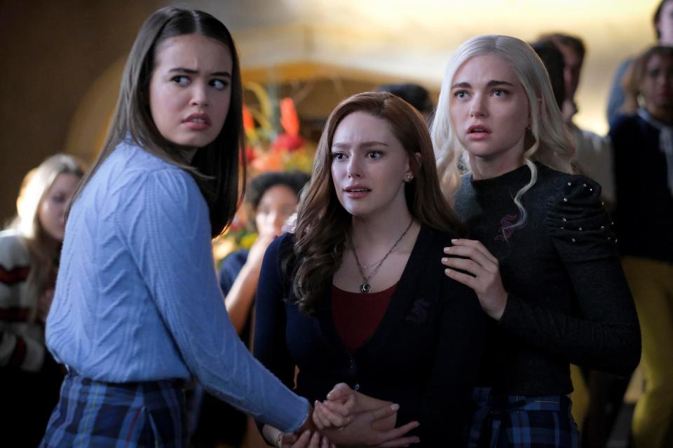 Josie Hope and Lizzie holding onto each other in &quot;Legacies&quot;