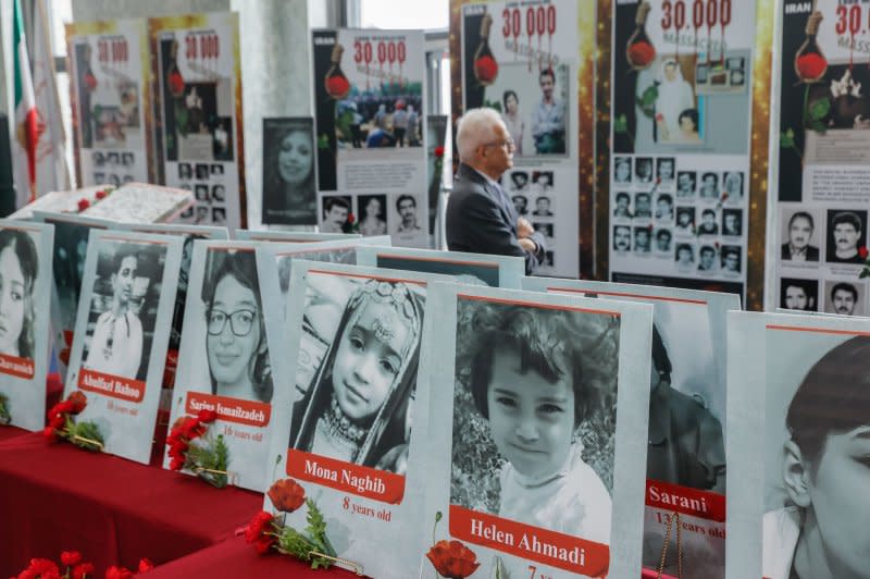 Photos on display at the "Fallen for Freedom" exhibit at the Rayburn Office Building in Washington in July honor the 30,000 victims of the Iranian government's 1988 massacre and to pay tribute to those in Iran who are still fighting for freedom and democracy. File Photo by Jemal Countess/UPI