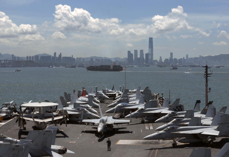 FILE - In this July 10, 2012 file photo, the USS George Washington aircraft carrier makes a port call in Hong Kong. As President Barack Obama tours Southeast Asia to push his year-old pivot to the Pacific policy, the big question on everybody's mind is how much of a role Washington, with its mighty military and immense diplomatic clout, can play in keeping the Pacific peaceful. (AP Photo/Kin Cheung, File)