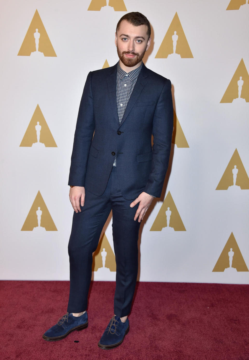 Sam Smith, who got an invitation to the exclusive event for the “Spectre” theme song “Writing’s on the Wall,” wore a blue ensemble to the 88th Annual Academy Awards nominee luncheon on February 8, 2016 in Beverly Hills, California.