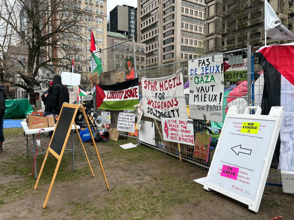 Pro-Palestinian protesters remain on McGill University's lower field after setting up an encampment Saturday. (Rowan Kennedy/CBC - image credit)