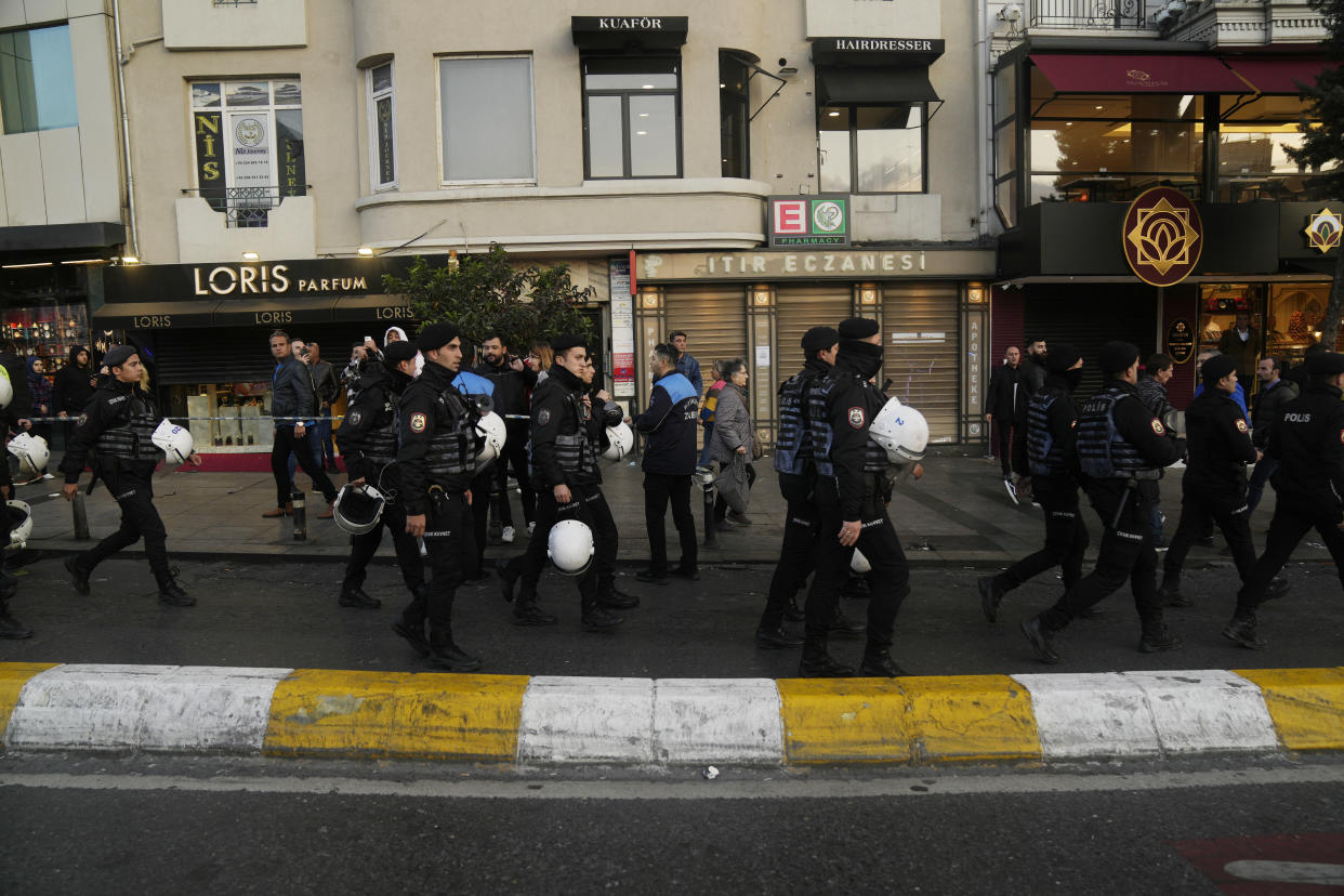 Security at the scene after an explosion on Istanbul's popular pedestrian Istiklal Avenue, Sunday, Nov. 13, 2022. Istanbul Gov. Ali Yerlikaya tweeted that the explosion occurred at about 4:20 p.m. (1320 GMT) and that there were deaths and injuries, but he did not say how many. The cause of the explosion was not clear. (AP Photo/Francisco Seco)