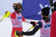 Switzerland's Wendy Holdener, left, embraces Switzerland's Anna Swenn Larsson after a World Cup slalom skiing race Sunday, Nov. 27, 2022, in Killington, Vt. (AP Photo/Robert F. Bukaty)