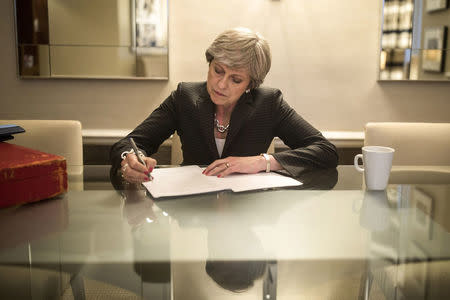 British Prime Minister Theresa May is pictured in her hotel room as she prepares her conference speech that she will deliver to her party's annual conference, tomorrow, in Manchester Central conference center, in Manchester, Britain, October 3, 2017. REUTERS/Christopher Furlong/ Pool