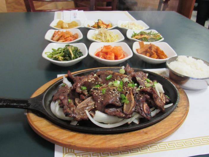 La kalbi and banchan (petite side plates) at Ming-Ga Korean Restaurant.