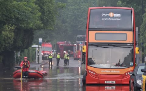 Emergency services on Pershore Road where twenty people were trapped on a flooded bus and had to be rescued by boat - Credit: Michael Scott/Caters News