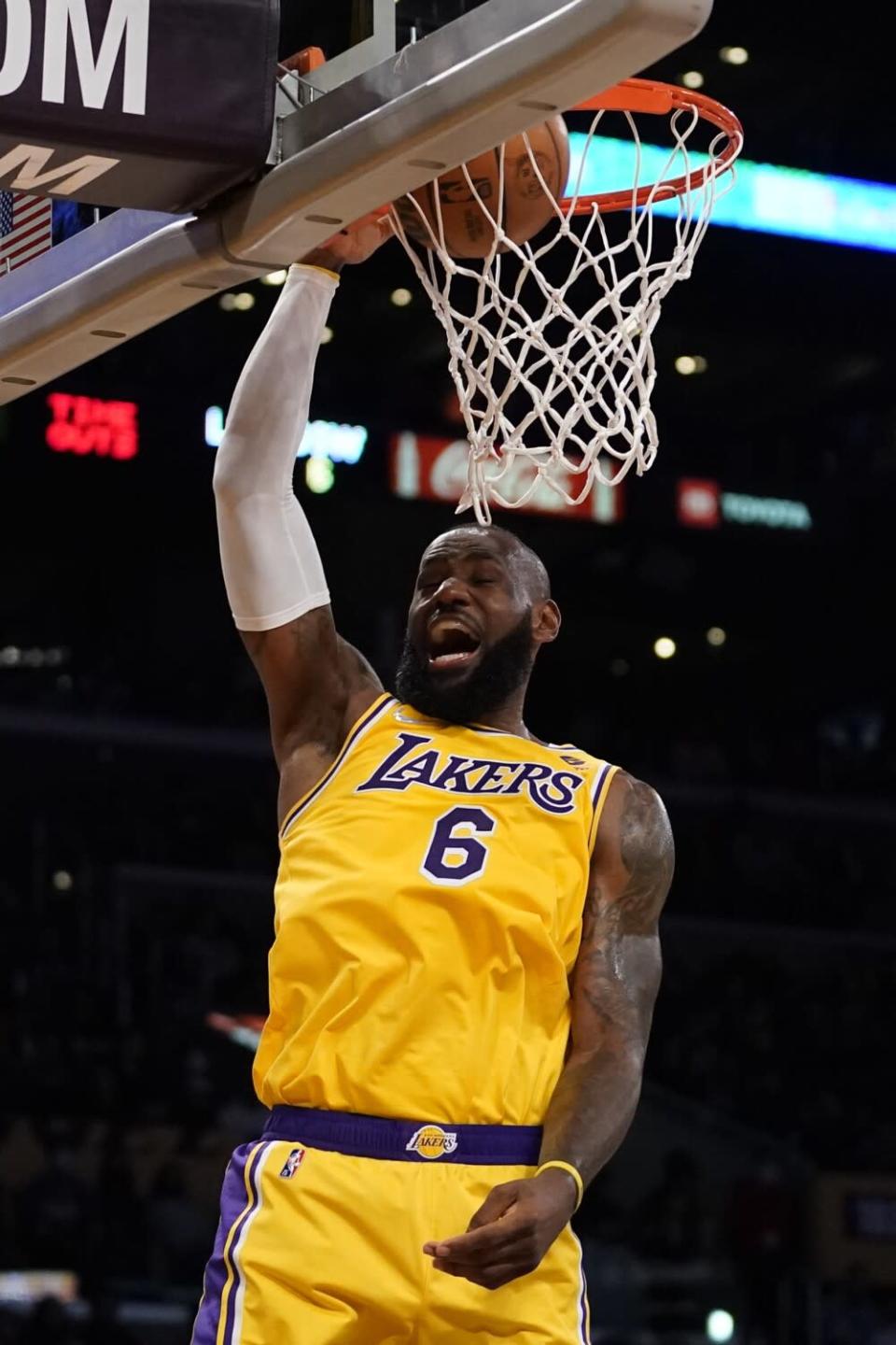 The Lakers' LeBron James dunks during the first half against the Golden State Warriors on March 5, 2022.