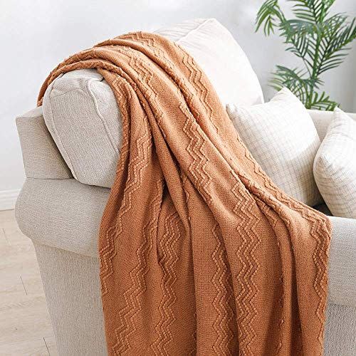 10) Bourina Textured Solid Sofa Throw