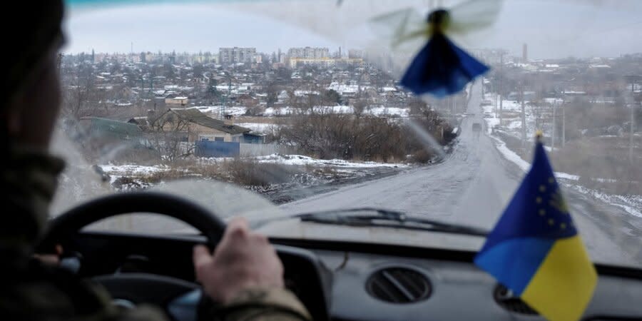 A Ukrainian military man drives a car in the Bakhmut district, Donetsk oblast