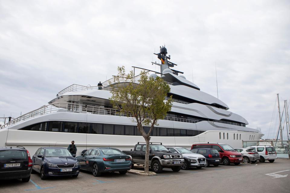 A Civil Guard stands by the yacht called Tango in Palma de Mallorca, Spain, on April 4, 2022.