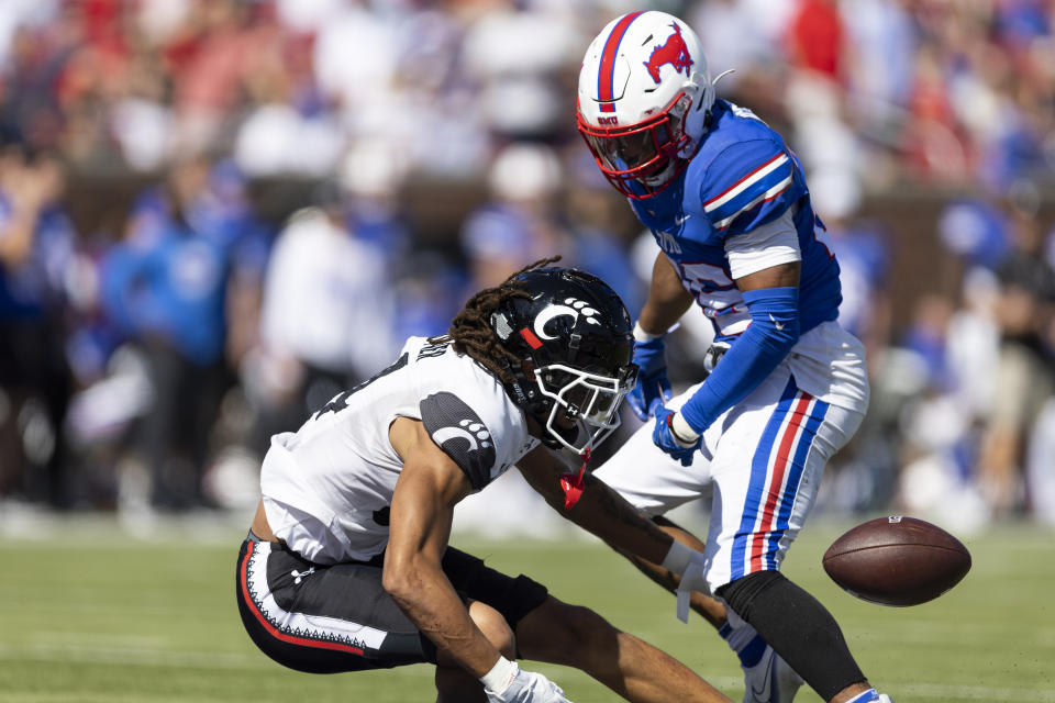 Cincinnati wide receiver Nick Mardner (84) drops a pass at the goal line as SMU cornerback Sam Westfall (26) defends during the first half of an NCAA college football game Saturday, Oct. 22, 2022, in Dallas. (AP Photo/Brandon Wade)