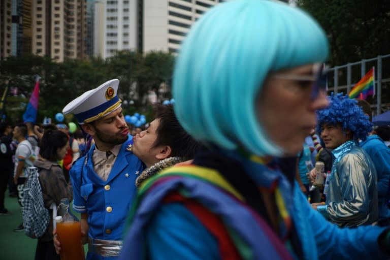 The British lesbian known only as QT accused the Hong Kong government of being out of step with public opinion, which although divided in the socially conservative city is warming to LGBT rights 