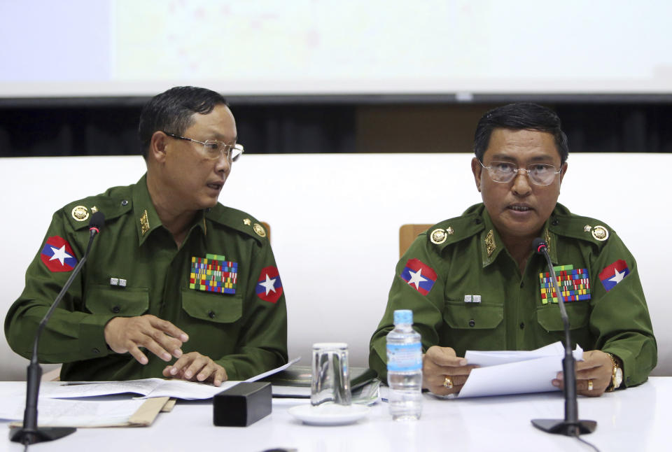 Maj. Gen. Nyi Nyi Tun, left, vice chairman of the Myanmar's military information committee, and Maj. Gen. Soe Naing Oo, chairman of the Myanmar's military information committee speak to journalists during a press conference at the Military Museum in Naypyitaw, Myanmar, Friday, Jan. 18, 2019. (AP Photo/Aung Shine Oo)