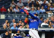 Aug 10, 2018; Bronx, NY, USA; Texas Rangers first baseman Ronald Guzman (67) bats against the New York Yankees during the eighth inning at Yankee Stadium. Mandatory Credit: Andy Marlin-USA TODAY Sports