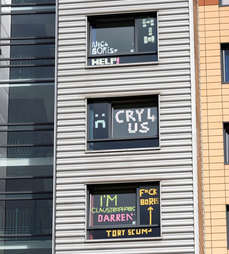 Students have posted protest signs and messages on windows of their rooms in Parker House hall of residence at Abertay University in Dundee (Alamy Live News)