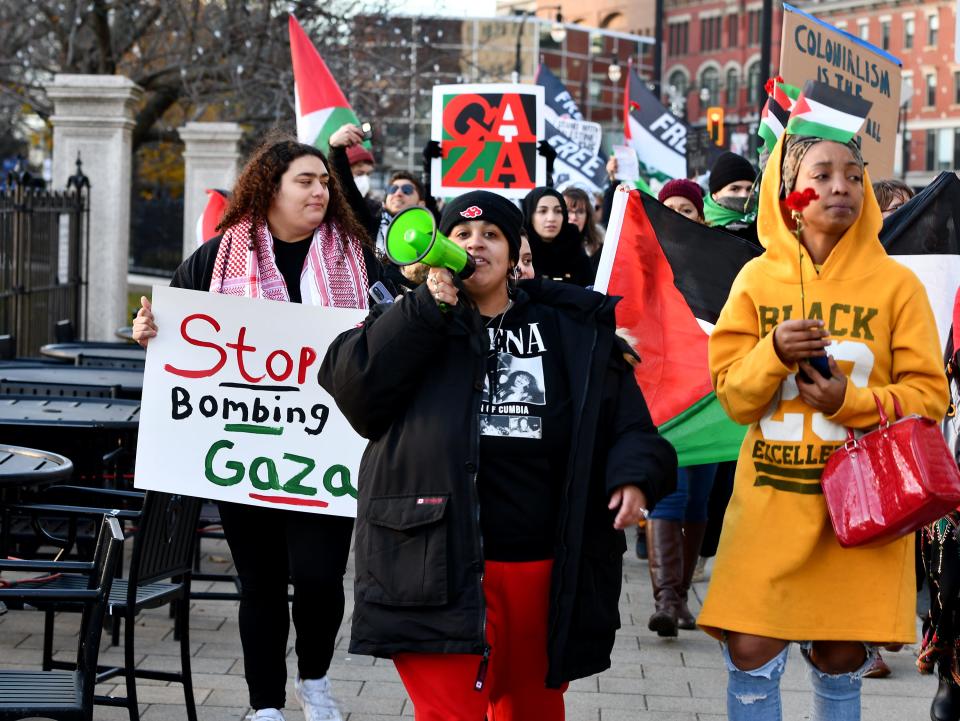Tatiana Carrion of the Worcester Solidarity Coalition helps lead a Free Palestine rally and march around downtown Worcester on Friday.
