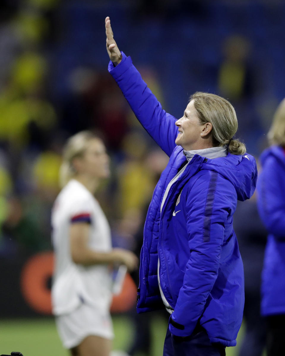 United States coach Jill Ellis waves to the crowd following her team's 2-0 win over Sweden in their Women's World Cup Group F soccer match at Stade Océane, in Le Havre, France, Thursday, June 20, 2019. (AP Photo/Alessandra Tarantino)