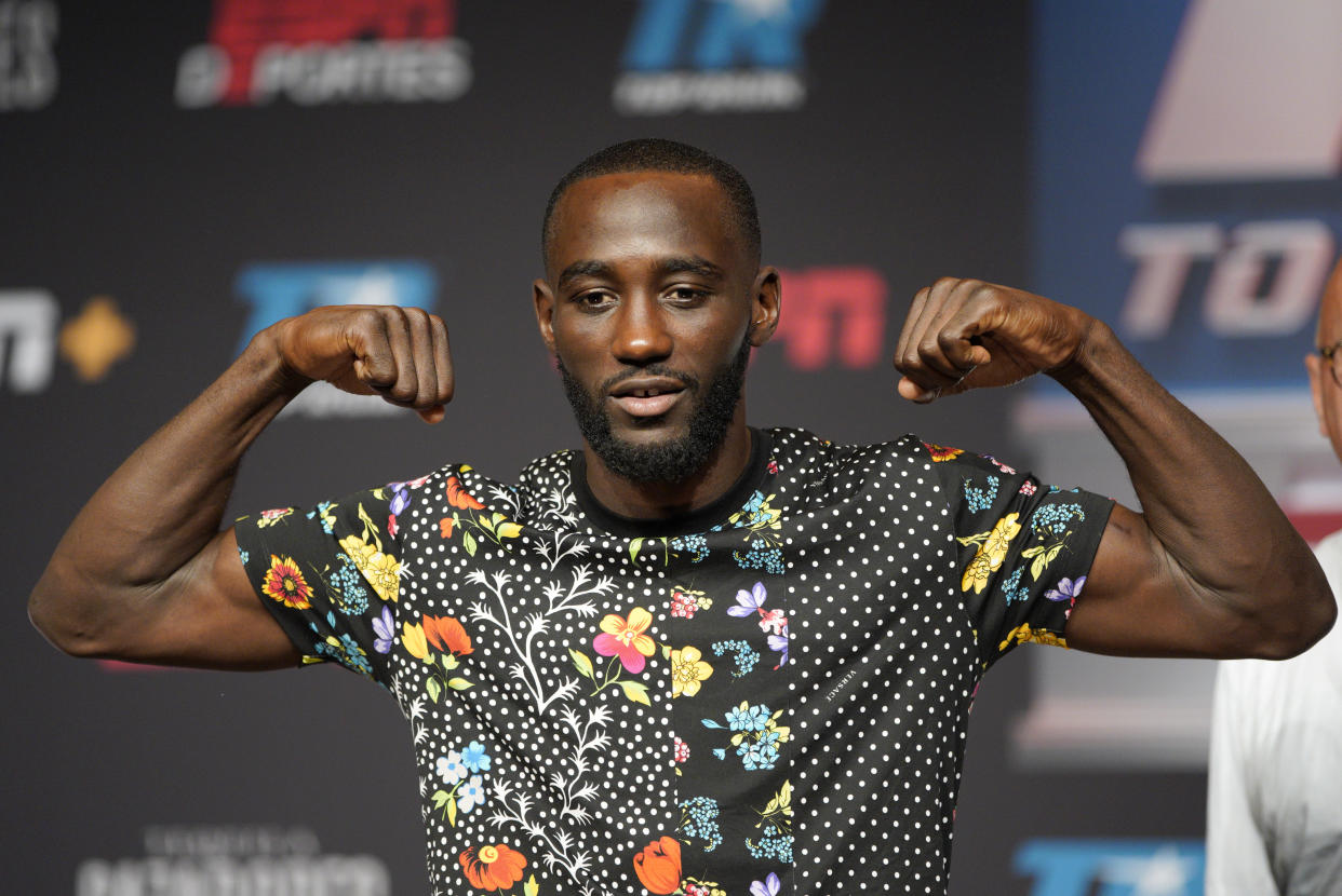 Terence "Bud" Crawford of Omaha strikes a pose following a news conference in Omaha, Neb., Thursday, Oct. 11, 2018, ahead of his welterweight WBO world title bout against Jose Benavidez Jr. of Phoenix on Saturday. There has been friction between Benavidez and Crawford since February, when Benavidez accused Crawford, the champ, of ducking him. (AP Photo/Nati Harnik)