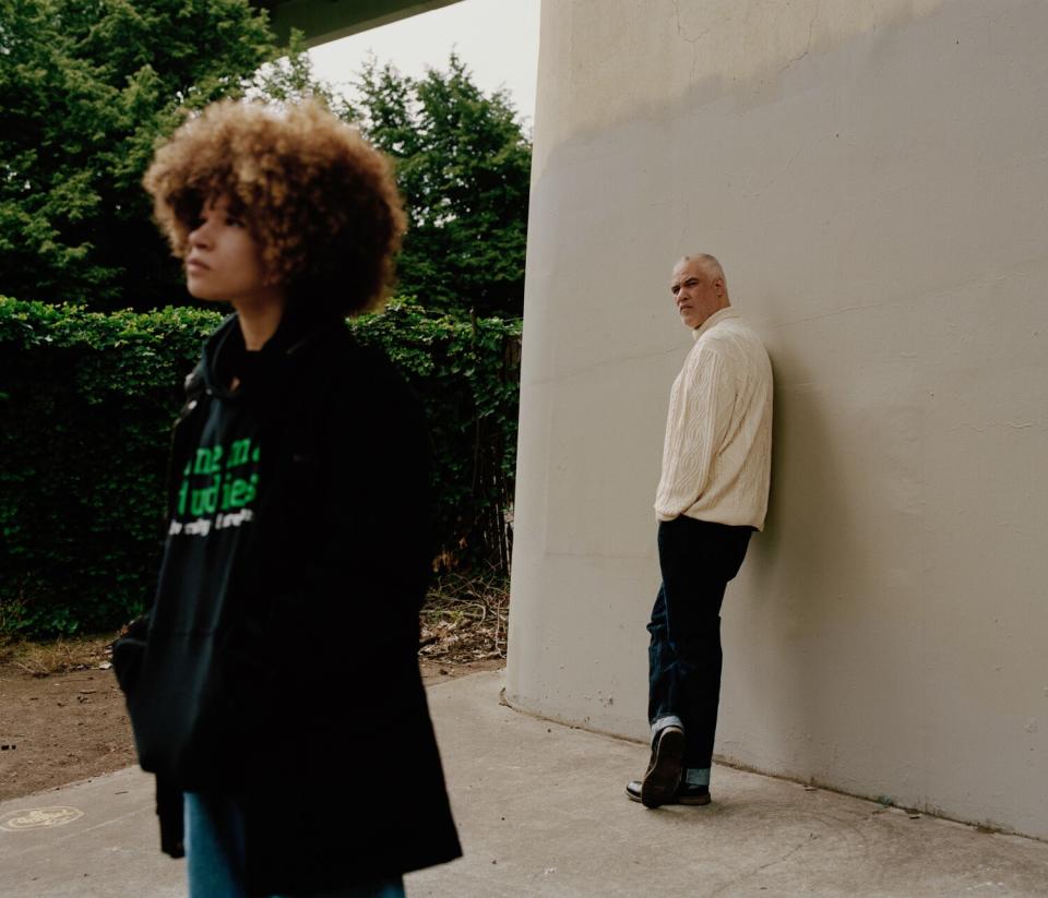 Johnson's teenage daughter, foreground, and him looking toward her.