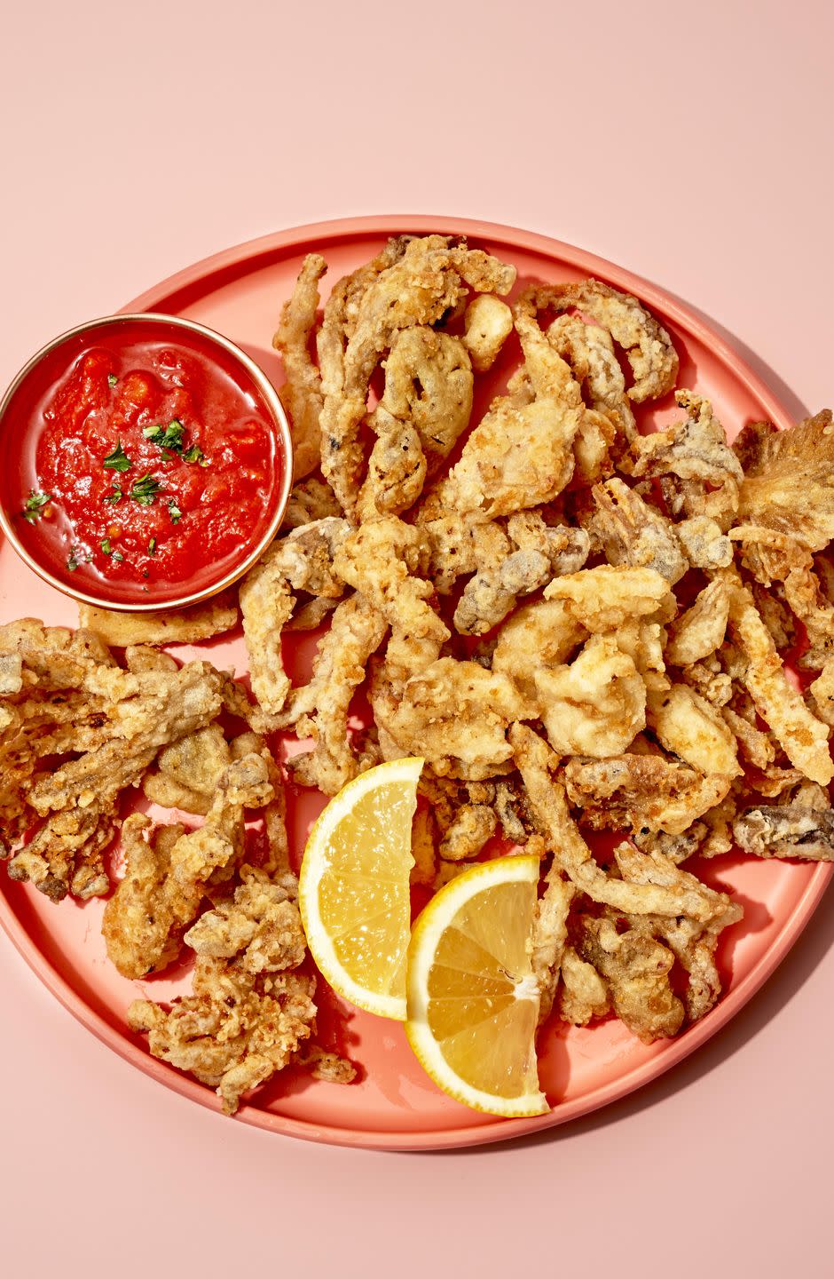 <p>Umami-rich oyster mushrooms are lightly battered and fried for this squid-free take on a <a href="https://www.delish.com/cooking/recipe-ideas/a35396283/fried-calamari-recipe/" rel="nofollow noopener" target="_blank" data-ylk="slk:seafood favorite;elm:context_link;itc:0;sec:content-canvas" class="link ">seafood favorite</a>. You can use other <a href="https://www.delish.com/cooking/g1915/mushroom-recipes/" rel="nofollow noopener" target="_blank" data-ylk="slk:mushroom;elm:context_link;itc:0;sec:content-canvas" class="link ">mushroom</a> varieties, but the delicate “petals” of the oyster mushrooms get <em>especially</em> crispy.</p><p>Get the <strong><a href="https://www.delish.com/cooking/recipe-ideas/a37051972/mushroom-calamari-recipe/" rel="nofollow noopener" target="_blank" data-ylk="slk:Mushroom “Calamari” with Spicy Marinara recipe;elm:context_link;itc:0;sec:content-canvas" class="link ">Mushroom “Calamari” with Spicy Marinara recipe</a></strong>.</p>