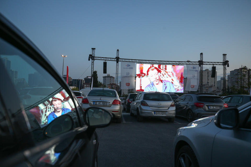 ISTANBUL, TURKEY - MAY 28: A view of cars during drive-in-theatre amid coronavirus (Covid-19) pandemic organized by CarrefourSA in Istanbul, Turkey on May 28, 2020. The Turkish movie "Our Family" was screened on the theatre. (Photo by Muhammed Enes Yildirim/Anadolu Agency via Getty Images)