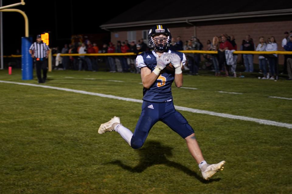 River Valley's Keyan Shidone hauls in a touchdown pass during a football game with Pleasant last season.