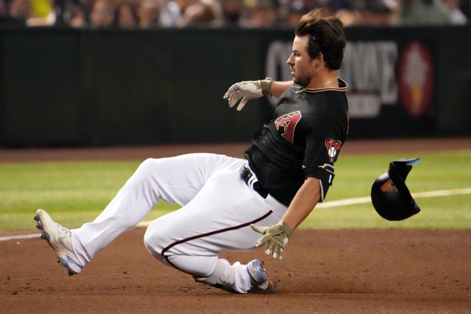 Jun 18, 2022; Phoenix, Arizona, USA; Arizona Diamondbacks second baseman Buddy Lewis Kennedy (45) slides into third base against the Minnesota Twins during the fifth inning at Chase Field.