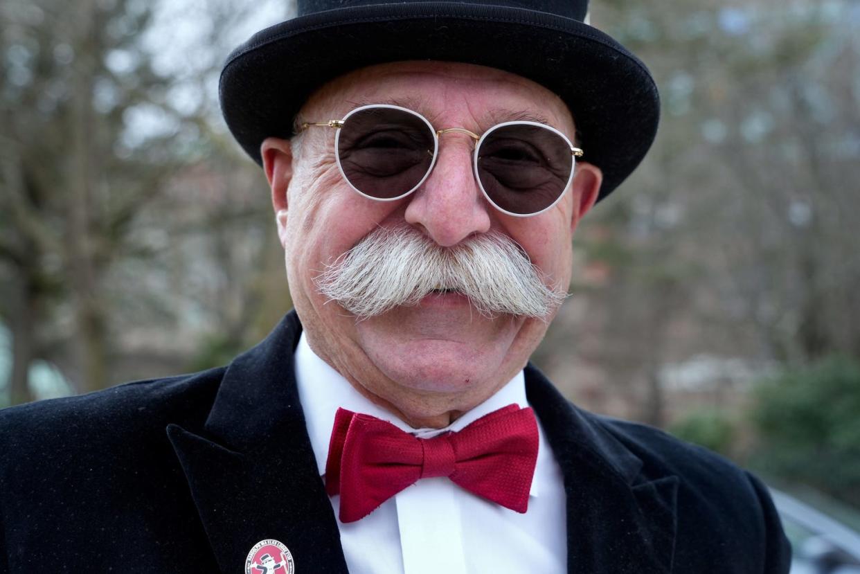 Vin Marzullo, who folks think looks like "Rich Uncle" Pennybags (Milburn Pennybags), the cartoon mascot for the Monopoly board game is a volunteer at the Hasbro Children's Hospital in Providence. He is photographed across the street from the hospital on January 29, 2024