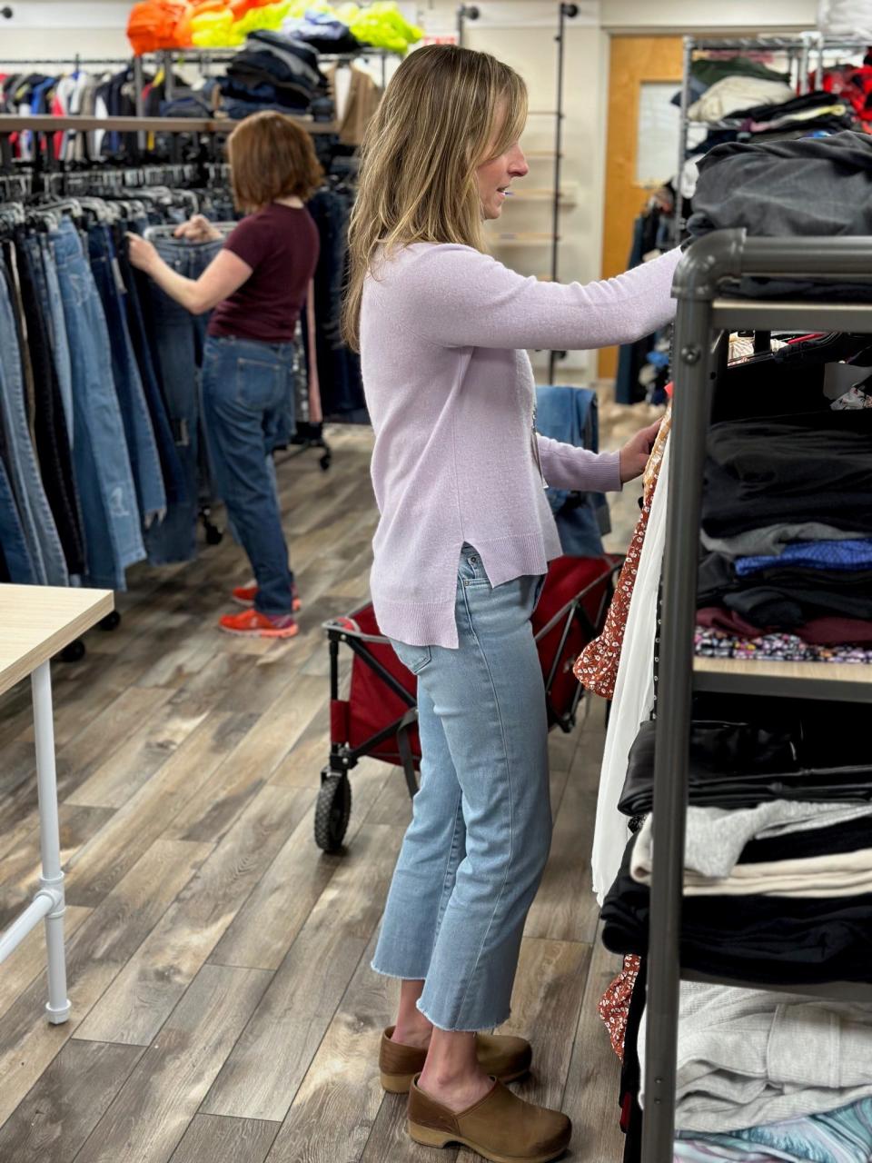 Staff and volunteers arrange clothing at The Sharing Shelf's Teen Boutique in Port Chester, where teens in need can shop for free and choose outfits in a private and dignified boutique-style environment. The Sharing Shelf was founded in 2009 to "address clothing insecurity and meet the basic needs of low-income children and teens in Westchester County."