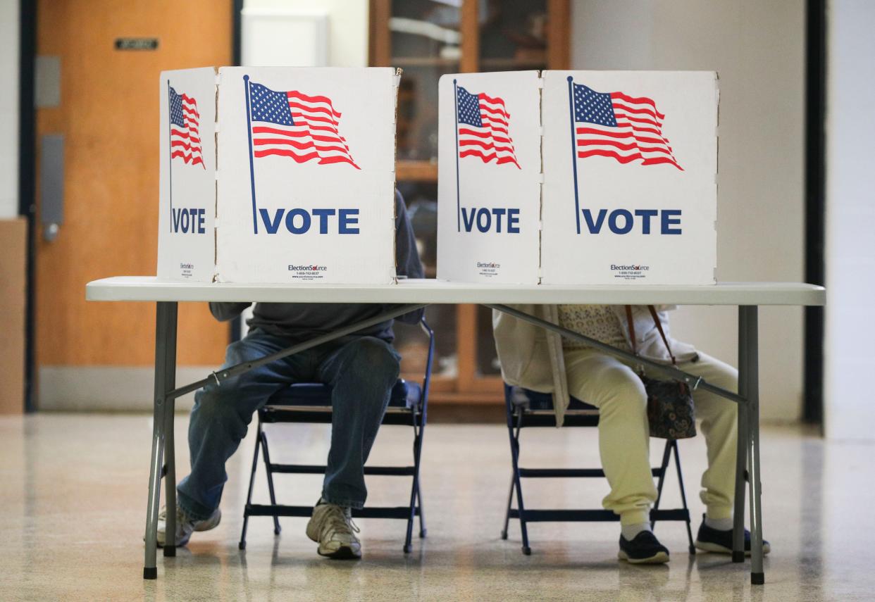 Charles and Mary Beaven vote at the Iroquois High School polling precinct during the 2023 Kentucky Primary Election in Louisville on May 16, 2023.