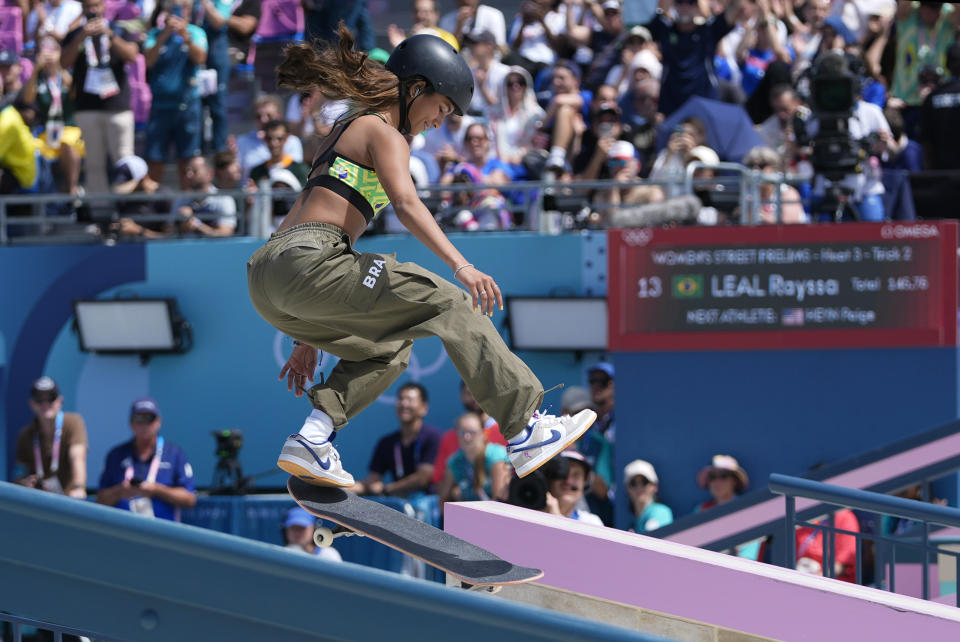 Rayssa Leal, of Brazil, performs a trick during the women's skateboard street preliminaries at the 2024 Summer Olympics, Sunday, July 28, 2024, in Paris, France. (AP Photo/Frank Franklin II)